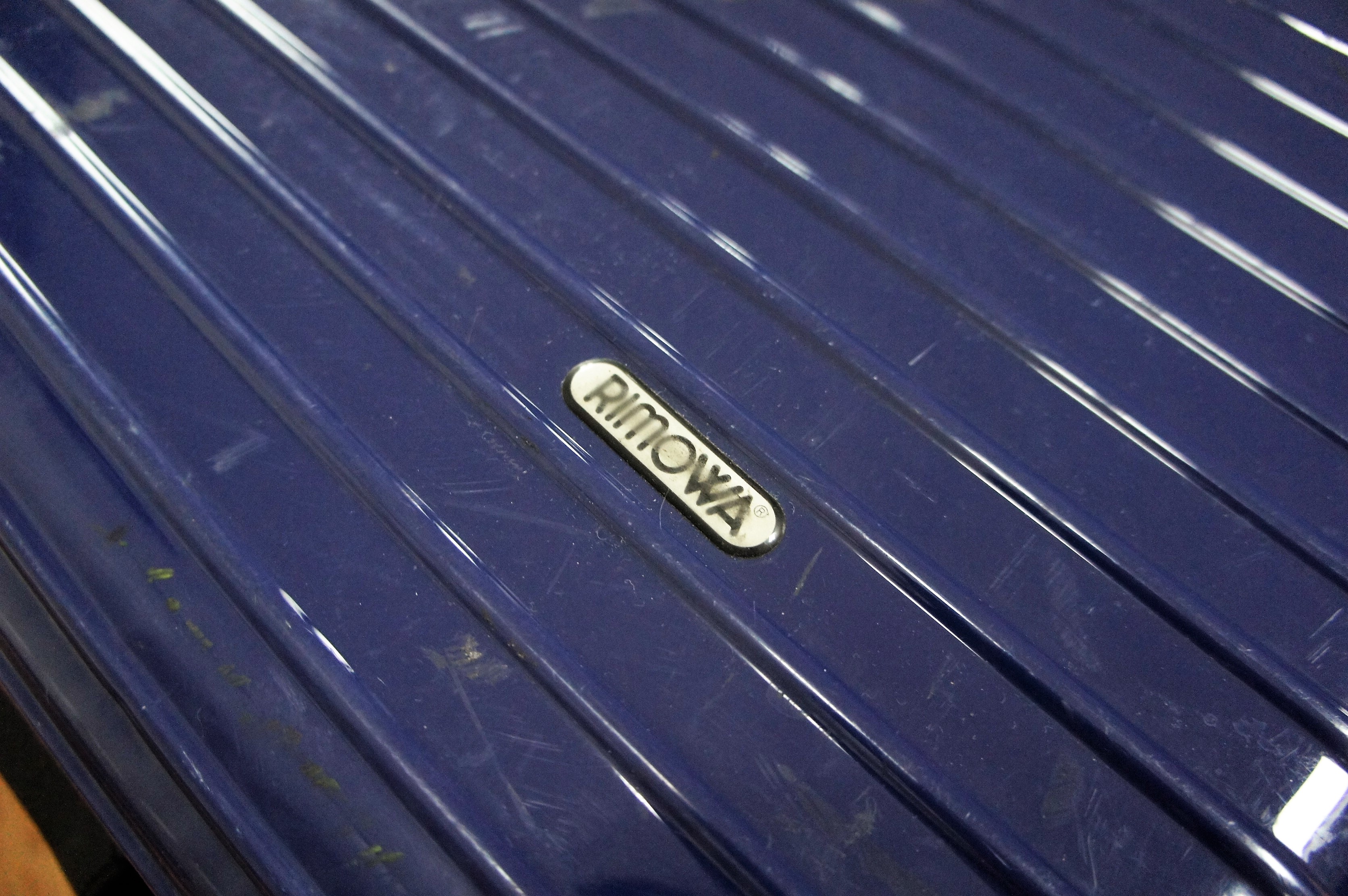 Rimowa logo on suitcase