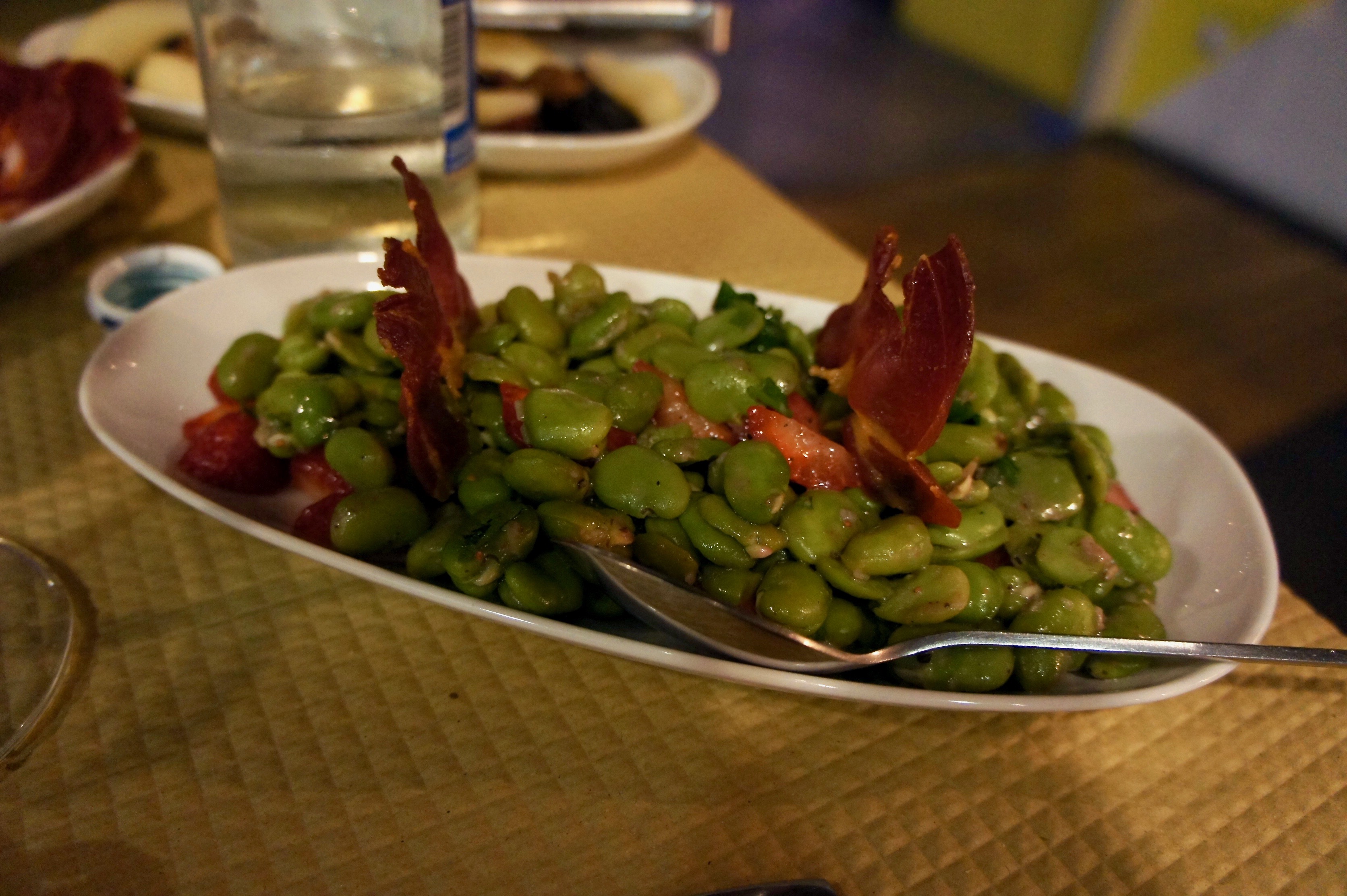 Broad beans with strawberries and grilled smoked ham at Banca de Pau in Lisbon