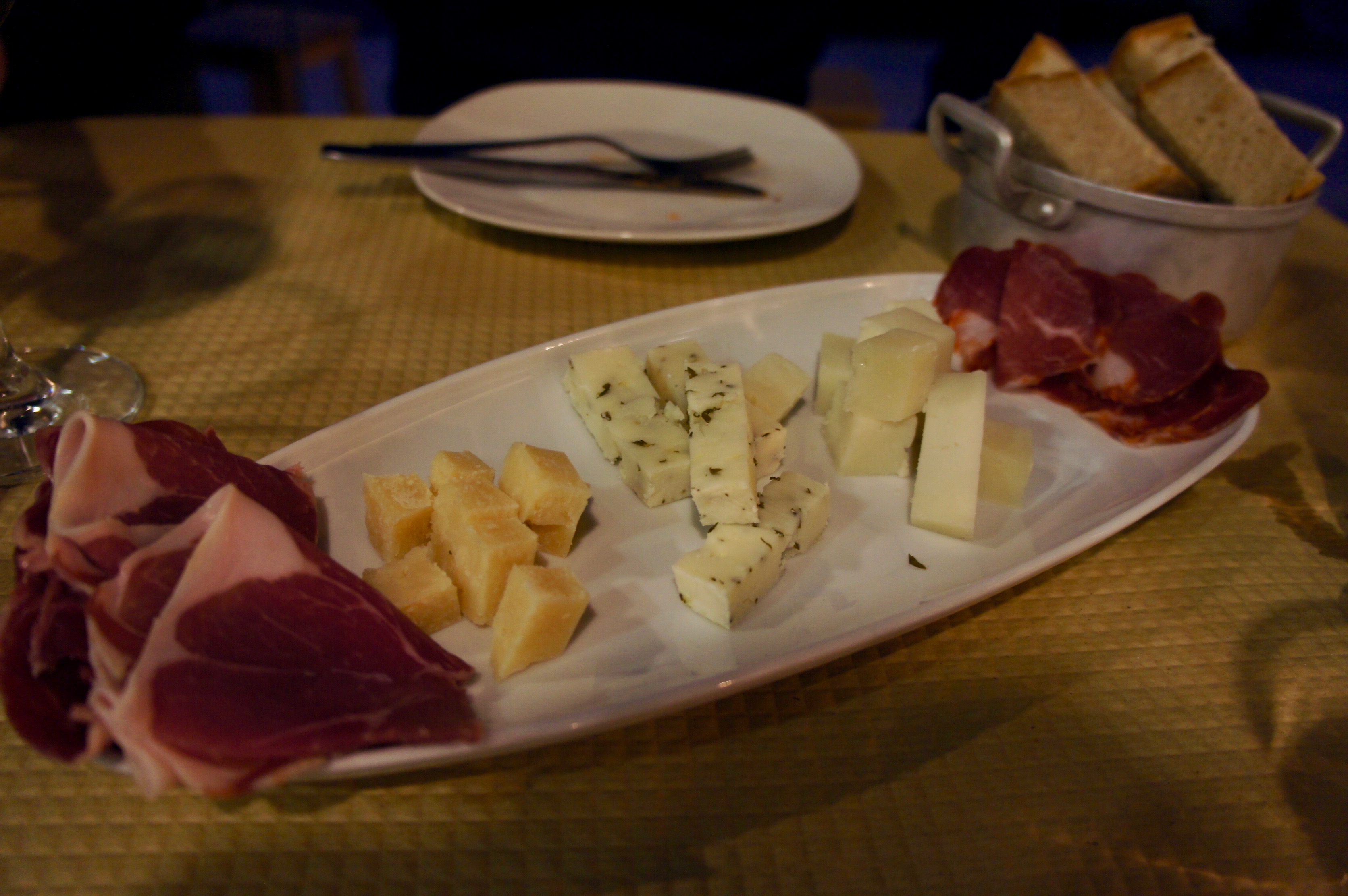 Mixed charcuterie and cheese platter at Banca de Pau in Lisbon