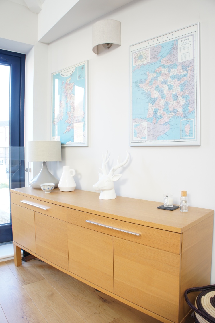 Ikea sideboard and vintage maps in living-room