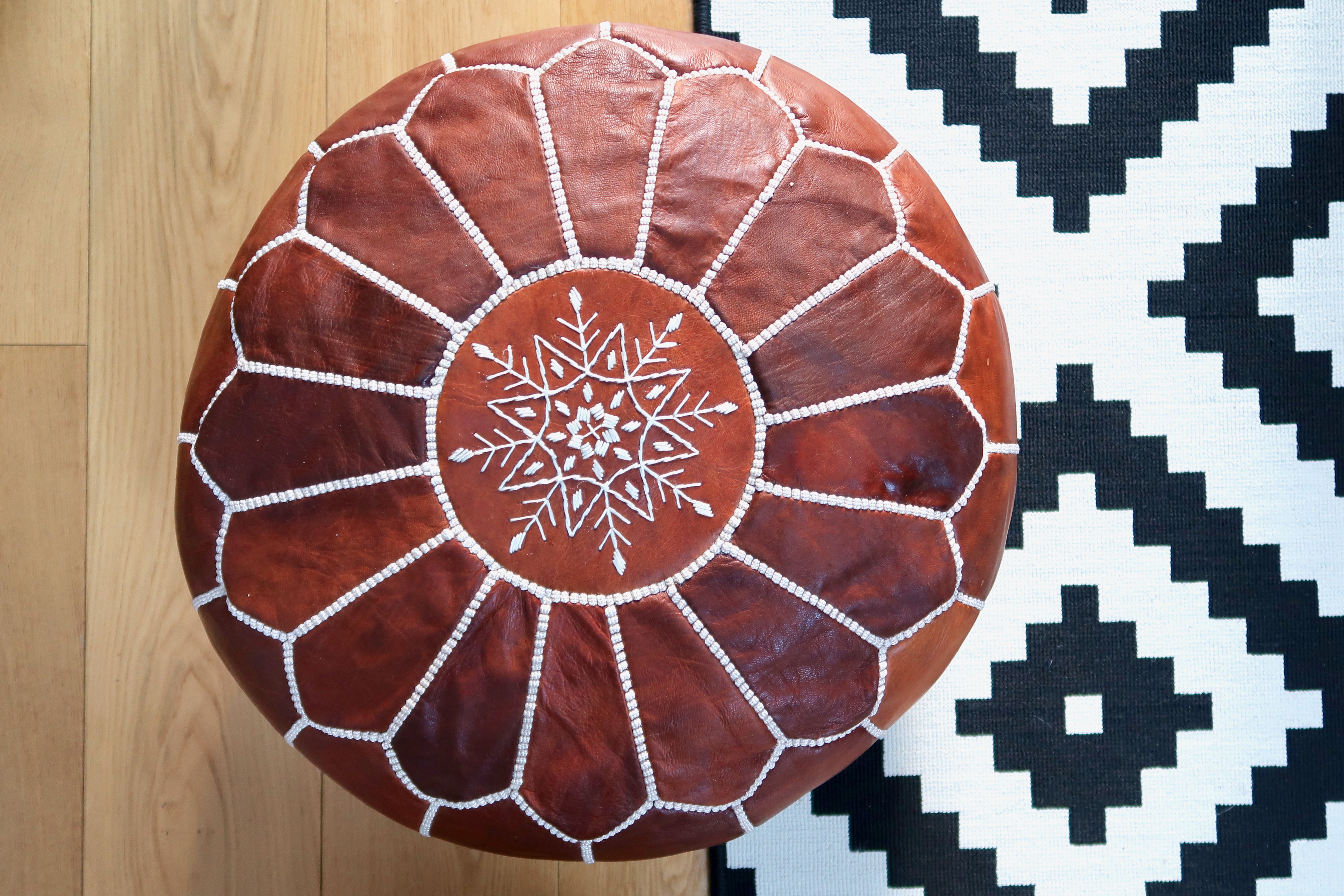 Tan Moroccan pouffe, Ikea rug